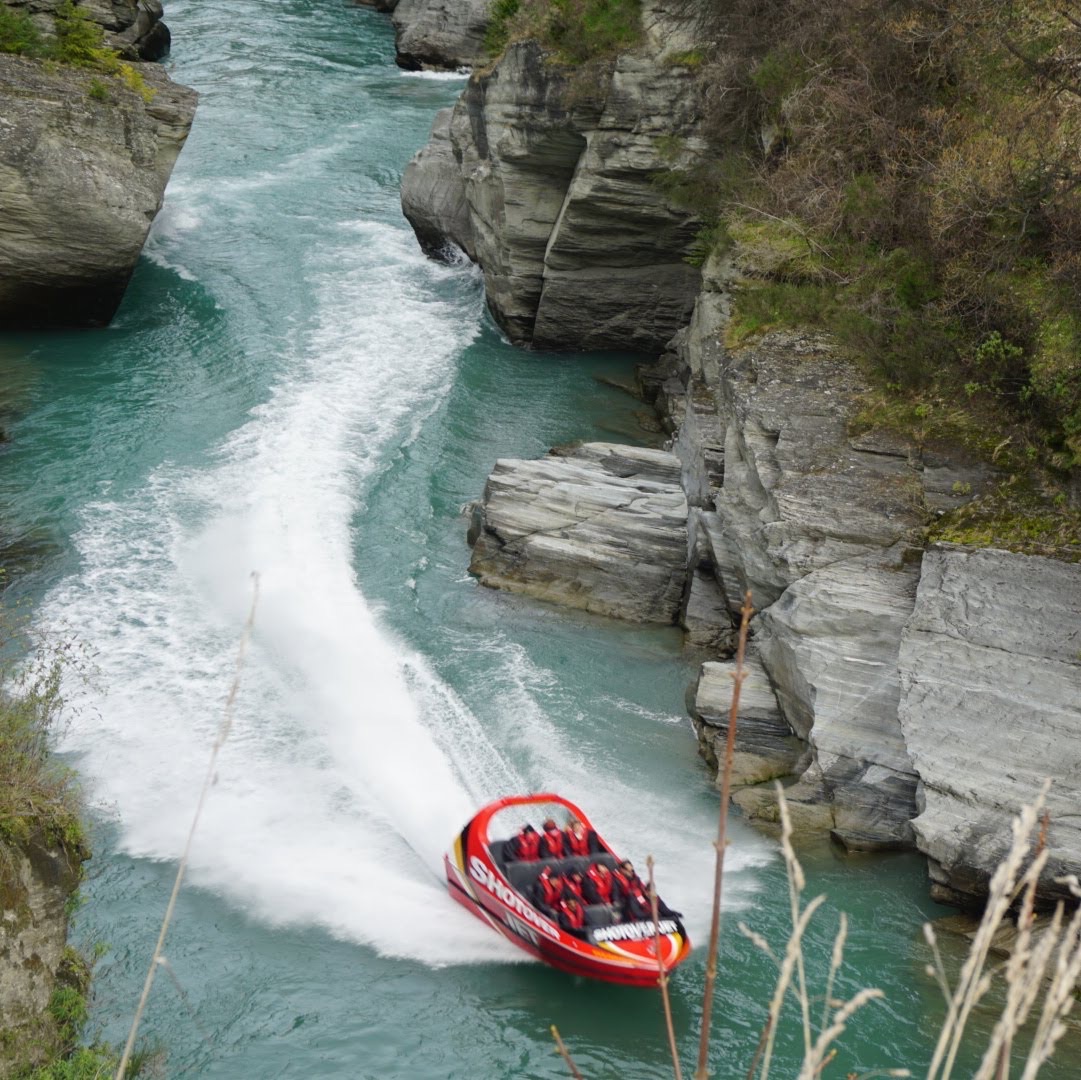 Shotover Jet speeding through a river canyon